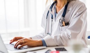 Doctor working on laptop medisave